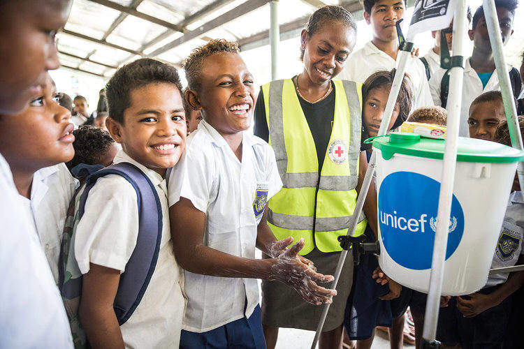 Students from a Honiara school wash their hands at a workshop run by UNICEF in the Solomon Islands